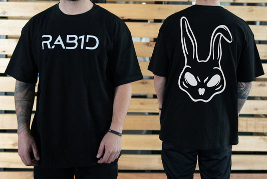 Black t-shirt with 'RAB1D' logo on front and bunny graphic on back, worn by a person.
