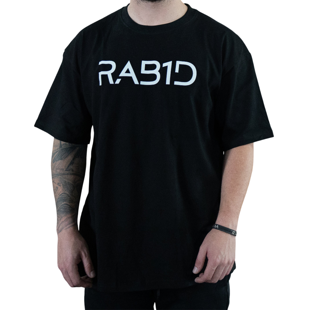 Person wearing a black t-shirt with 'RAB1D' printed on it against a white background