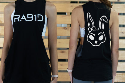 Black womens tank top with 'RAB1D' on the front and a rabbit face design on the back, worn by two people.